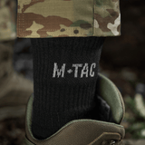 M-Tac Sokker Winter Wool mustina, valmistettu merinovillasta, käytetty sotilasaappaissa, sopivat talvikäyttöön maksimaalista lämpöä ja mukavuutta varten.