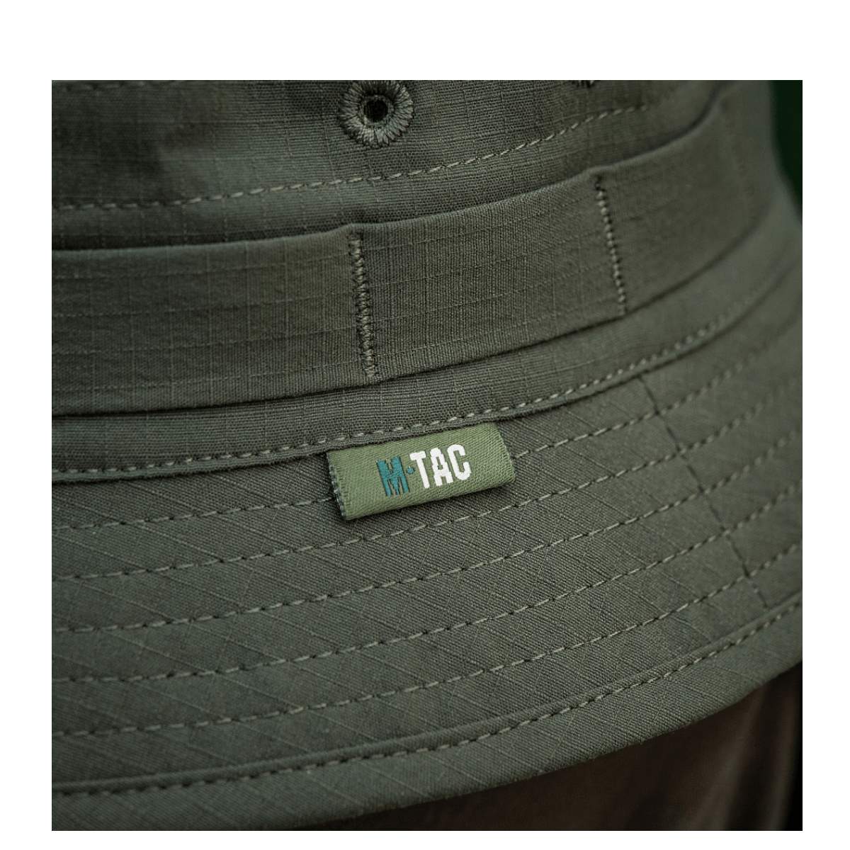 Lähikuva M-Tac Panamahat Gen. II Summer Flex oliivinvihreä nylon/elastaani, NIJ-sertifiointi, fokus saumoihin ja logoon, galleria-asento 1.