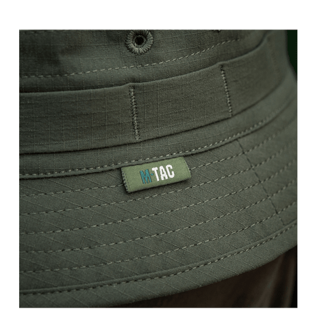 Lähikuva M-Tac Panamahat Gen. II Summer Flex oliivinvihreä nylon/elastaani, NIJ-sertifiointi, fokus saumoihin ja logoon, galleria-asento 1.