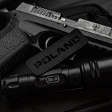 M‑Tac Patch Poland End-to-End 25x80 Cordura 500D:ssä tarrakiinnityksellä ja Laser Cut -kuvioinnilla, näytettynä yhdessä mustan varusteen kanssa.