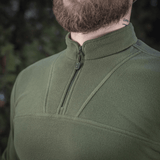M-Tac Delta Polartec fleece-takki vihreänä, puolivetoketjulla, valmistettu kulutusta kestävästä ja lämpimästä Polartec® Micro Series -fleecestä.
