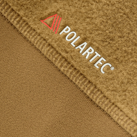 Polartec-kankaan yksityiskohta M-Tac Polartec Sport -fleecatakista, näyttää eristysmateriaalin tekstuurin ruskeana.