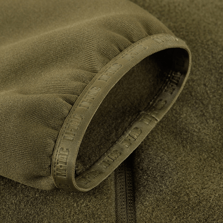 M-Tac Polartec Sport Fleecejakke -hihadetalji reunajoustolla ja Polartec® 200 Series -fleecellä oliivinvihreänä
