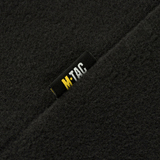 Lähikuva M-Tac Delta Polartec -naisten fleecetakista, musta M-Tac-logo kestävässä Polartec® Micro Series -fleecessä.