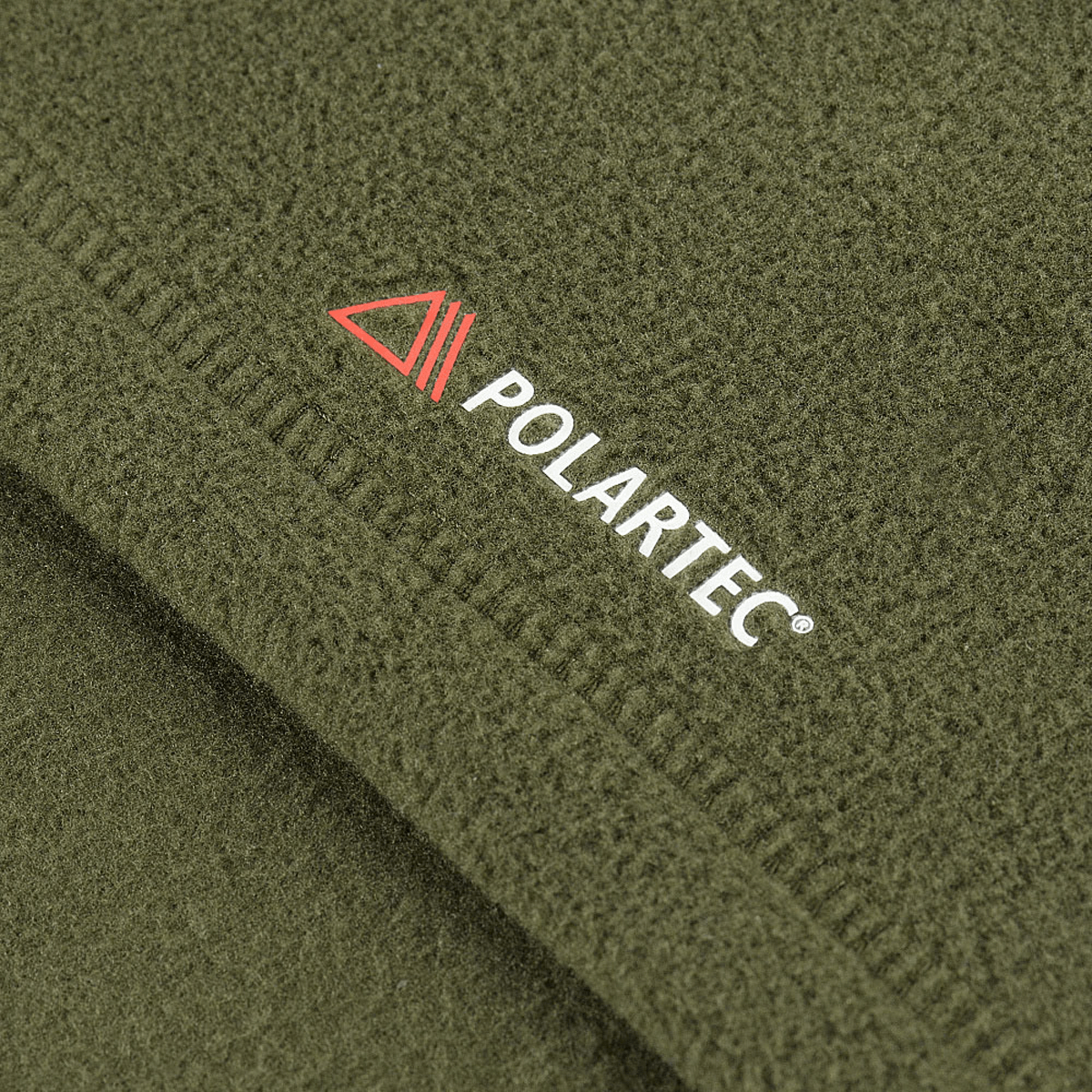 Lähikuva M-Tac Delta Polartec -naisten fleecetakista, Polartec®-logo vihreällä fleecellä.