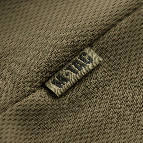 M-Tac Polo Elite Tactical Coolmax hengittävällä Coolmax®-kankaalla, suunniteltu poliisi- ja turvallisuustyöhön, lähikuva kankaan rakenteesta.