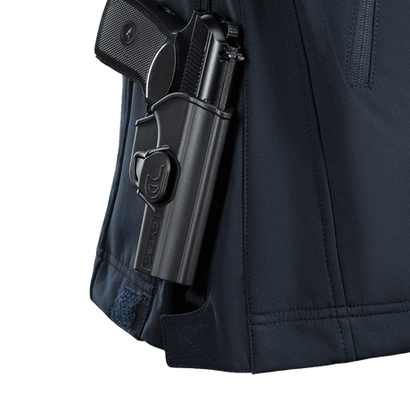 Yksityiskohta M-Tac Soft Shell Police Jakkeesta sisältä löytyvästä väline taskusta, korostaa toiminnallista leikkausta ja sääsuojaa.