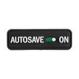 M-Tac Patch Autosave PVC 3D-muotoilulla ja Velcro-takapuolella, musta suorakulmio 'Autosave On' -tekstillä, sopii taktiseen varustukseen.