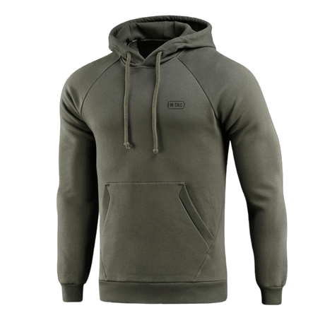 M-Tac Cotton Raglan Hard Hoodie vihreänä kengurutaskulla ja hupulla, suunniteltu arki- ja vapaa-ajan käyttöön.