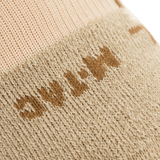 Yksityiskohta M-Tac Coolmax 35% Outdoor-sukasta beigessä, sopii ulkoaktiviteetteihin.