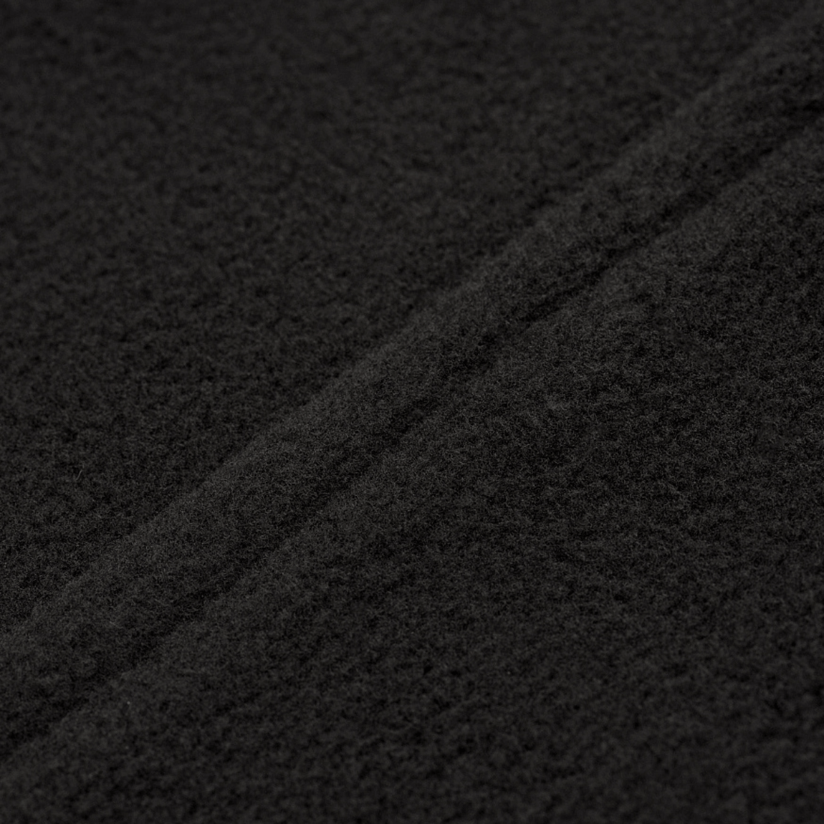 Lähikuva M-Tac Delta Fleece -takin materiaalista, näyttää fleece-rakenteen ja laadun, täydellinen ulkoiluun ja kylmään säähän