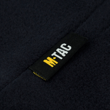 M-Tac Fleece Watch Cap Light Polartec Gen II Polartec Micro Series -fleecessä oleva merkkietiketti, lähikuva yksityiskohdista.