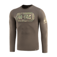 M-Tac T-Shirt Logo Long Sleeve maastokuvioituna, ikoninen M-Tac-logo ja slogan 'Born by Revolution – Hardened by War' hihassa.