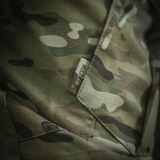 Lähikuva M-Tac Shorts STURM Gen.II Nyco Extreme camo-kuviosta, etiketti näkyvissä — sopii taktiseen käyttöön ja ulkoiluun.