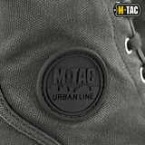 Lähikuva M-Tac Sneakersistä, kestävä takaosa, korostus metallisissa nauharenkaissa.