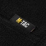 M-Tac Snood Elite Kort Justerbar Fleece -etiketti mustassa fleecessä, osoittaa kestävän ja pehmeän materiaalin, ihanteellinen kylmään säähän.