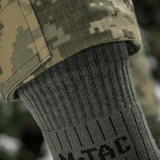 M-Tac Sokker Mid Calf Mk.4 miehille, suunniteltu mukavuuteen ja suojaan vaelluksessa, pehmustetut lämpövyöhykkeet ja joustava resori