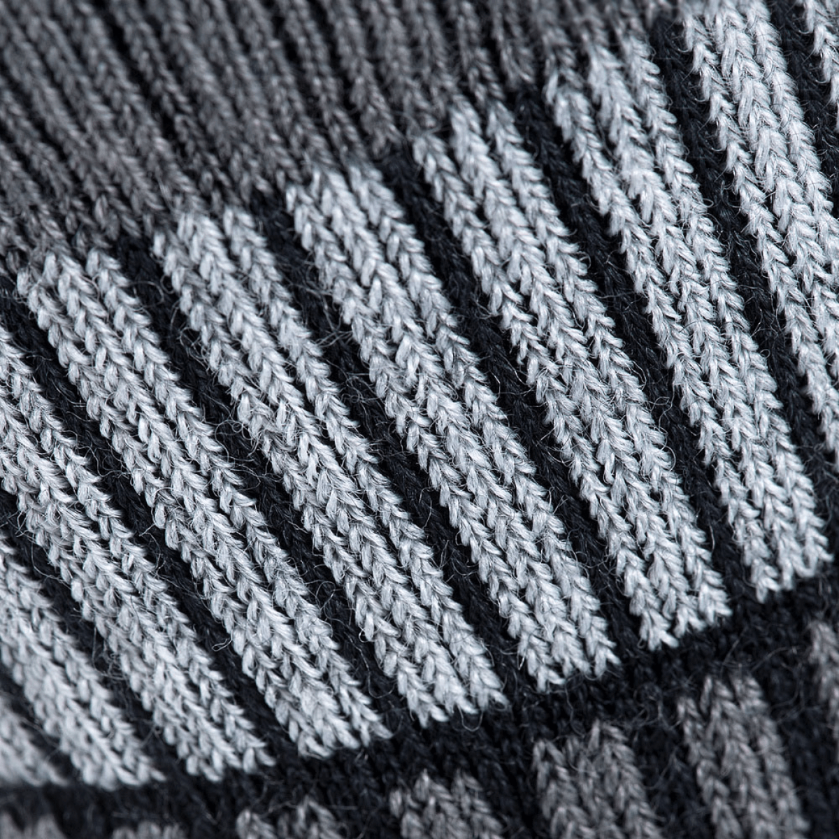 Lähikuva M-Tac Sokker Polar Merino 40%:sta selkeällä merinovillarakenteella, suunniteltu lämpöön ja kestävyyteen ulkoaktiviteeteissa.