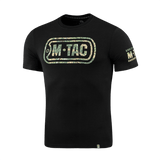 M-Tac T-Shirt Logo, camokuvio ja slogan "Born by Revolution – Hardened by War" mustalla taustalla.