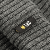 M-Tac Watch Cap 100% Akryl harmaa, neulospipo viileään säähän, matala profiili ja kaksoiskäänne lisälämmöksi, lähikuva tekstuurista.