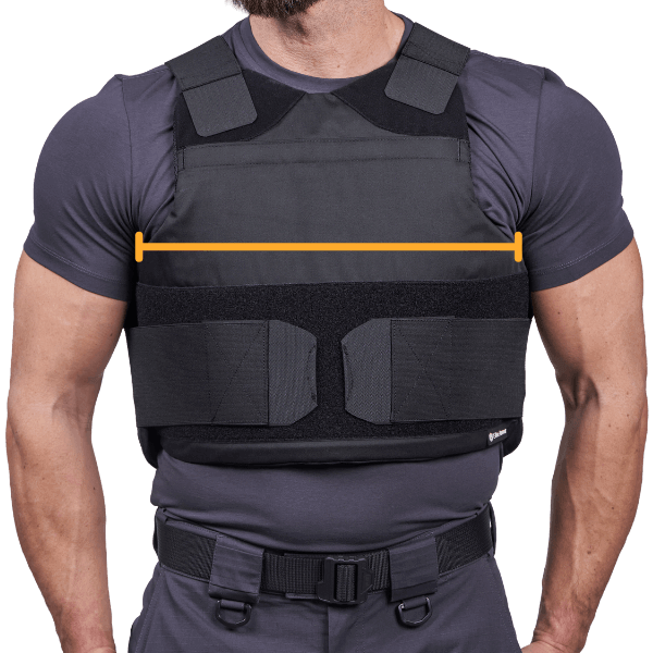 Man wearing bulletproof vest for tactical protection, showcasing measurement of armor width